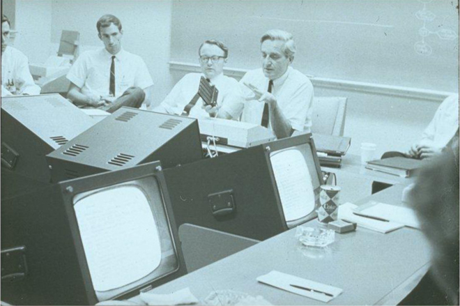 Don Andrews, Bill English, and Doug Engelbart at SRI's Augmentation Research Center during a meeting with sponsors of the program. The meeting was driven by NLS